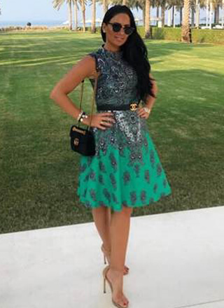 A popular media celebrity wearing a Comino Couture dress